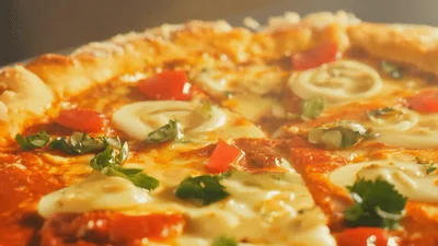 Close Up Of Freshly Baked Pizza With Melting Cheese