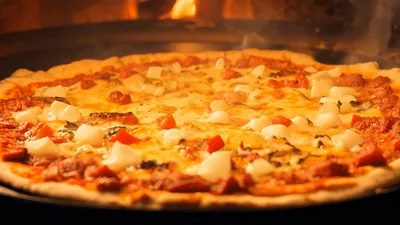 Pizza Baking In A Wood Fired Oven