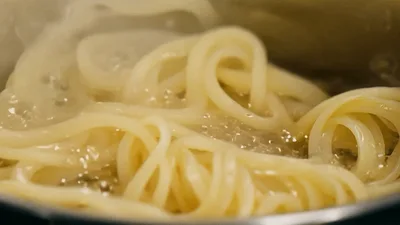Thick Udon Noodles Boiling In A Pot