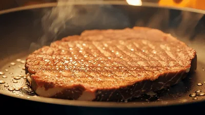 Ribeye Steak Searing In A Hot Skillet