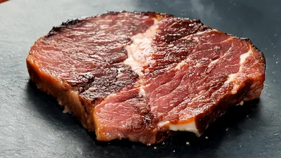 Smoked Beef Steak Sizzling On A Hot Stone Plate