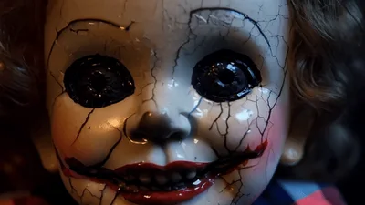 Creepy Cracked Porcelain Doll Face With Sinister Smile