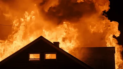 House Roof Engulfed In Intense Nighttime Fire