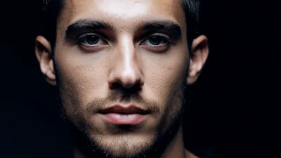 Close Up Portrait Of A Young Man Looking Forward