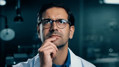 Scientist Thinking In Laboratory With Digital Data Visualization