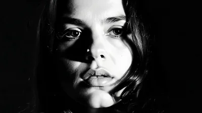 Close Up Portrait Of A Young Woman In Black And White