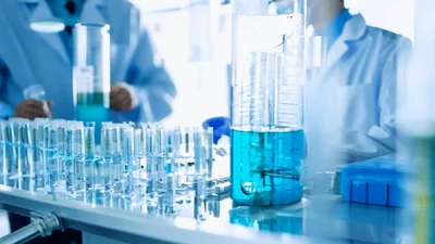 Scientists Conducting Chemical Experiments In A Modern Laboratory