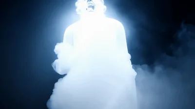 Glowing Supernatural Creature Roaring In Dark Foggy Environment