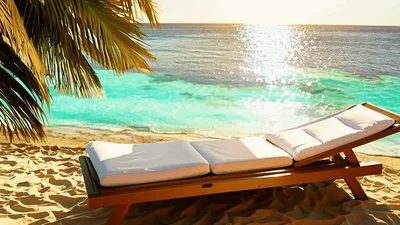 Empty Wooden Lounge Chair On Tropical Beach At Sunset