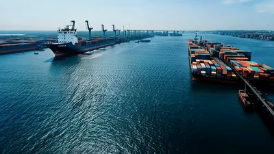 Aerial View Of Cargo Ships Docked At Port Terminal