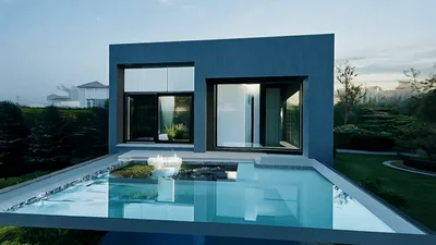 Modern Luxury House With Infinity Pool At Sunset