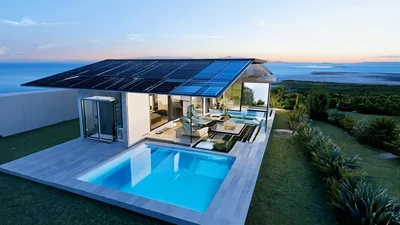 Modern Luxury Villa With Solar Roof At Sunset