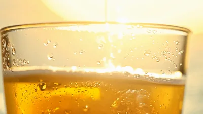 Golden Beer Pouring Into A Glass
