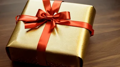 Golden Gift Box With Red Ribbon Rotating Slowly