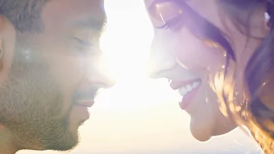 Romantic Couple Gazing Lovingly At Each Other Outdoors