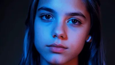 Young Girl Posing With Blue And Red Neon Lighting