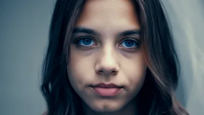 Close Up Portrait Of A Young Girl Looking Forward