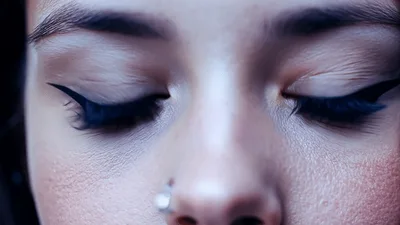Close Up Of A Young Woman Opening Her Blue Eyes