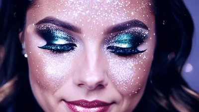 Beautiful Woman With Glitter Makeup Smiling At Camera