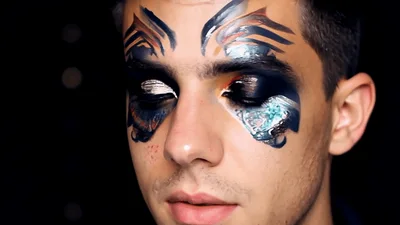 Young Man With Artistic Butterfly Wing Eye Makeup