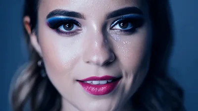 Close Up Portrait Of A Woman With Artistic Makeup