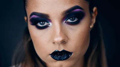 Woman With Dramatic Makeup Looking Into Camera