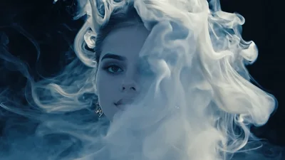 Beautiful Woman Surrounded By Swirling White Smoke