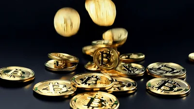 Golden Bitcoin Coins Falling Onto A Dark Surface