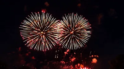 Colorful Fireworks Exploding Against Dark Night Sky