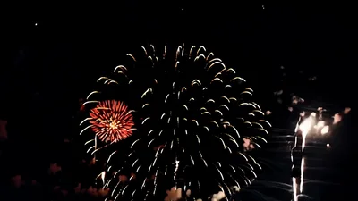 Colorful Fireworks Exploding Against Dark Night Sky