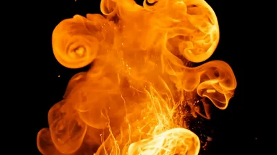 Large Fireball Explosion With Flying Sparks On Black Background