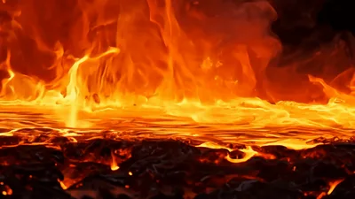 Molten Lava Flowing Over Dark Volcanic Rock
