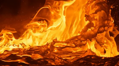 Molten Lava Flowing Over Volcanic Rock Surface