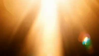 Golden Sun Rays Shining Through Lens Flare