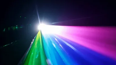Bright Laser Light Projecting Colorful Beams In Darkness