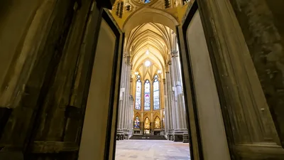 Large Wooden Church Doors Opening To Reveal Cathedral Interior