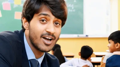 Young Male Teacher Talking To Students In Classroom