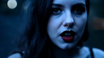 Gothic Woman With Dark Lipstick Looking Into Camera