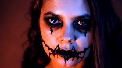 Young Woman With Creepy Halloween Makeup Staring Intently