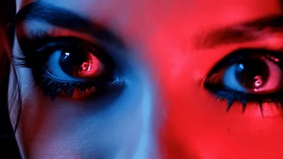 Close Up Of Woman With Dramatic Makeup Opening Eyes