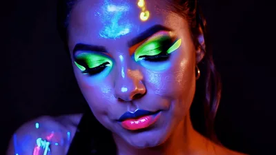 Woman With Neon Fluorescent Makeup Opening Her Eyes