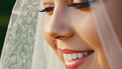 Close Up Of A Smiling Bride In A Veil
