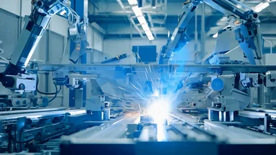 Automated Robotic Welding Arm Performing Industrial Assembly