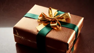 Golden Gift Box With Green Ribbon Rotating Slowly