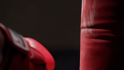 Red Boxing Glove Striking Heavy Punching Bag