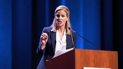 Professional Woman Giving A Speech At A Podium