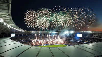 Fireworks Display Over A Packed Football Stadium At Night