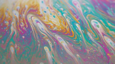 Abstract Macro View Of Swirling Iridescent Soap Film