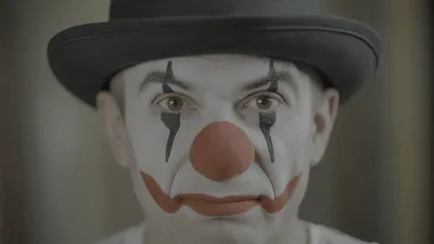 Close Up Portrait Of A Sad Clown Looking At Camera