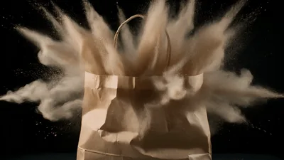 Brown Paper Bag Exploding With Flour Dust